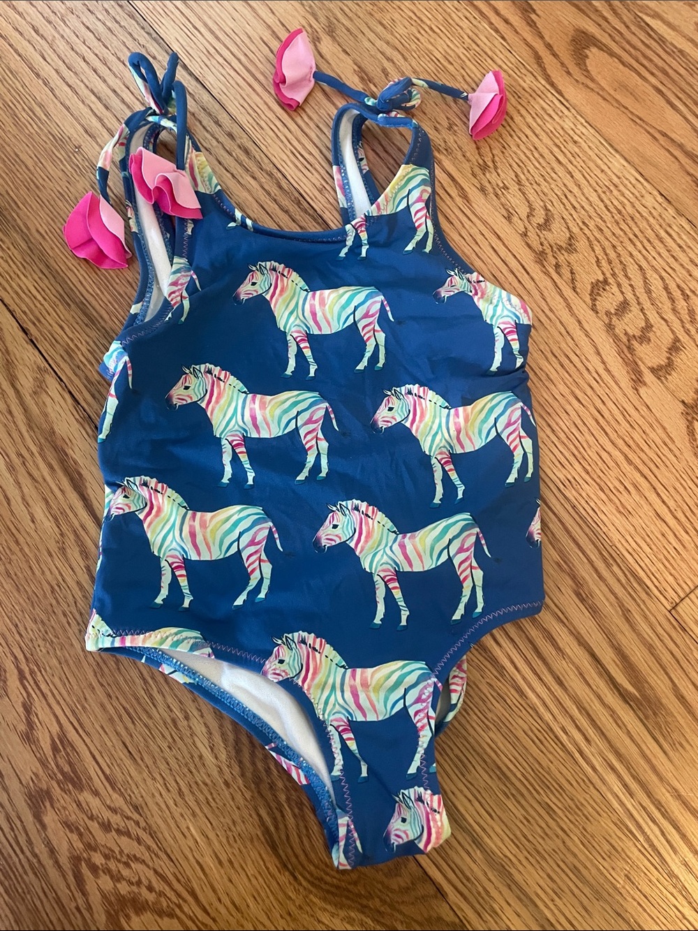 Hatley Navy One-Piece Swimsuit with Multicolor Zebra Print and Pink Tie Accents